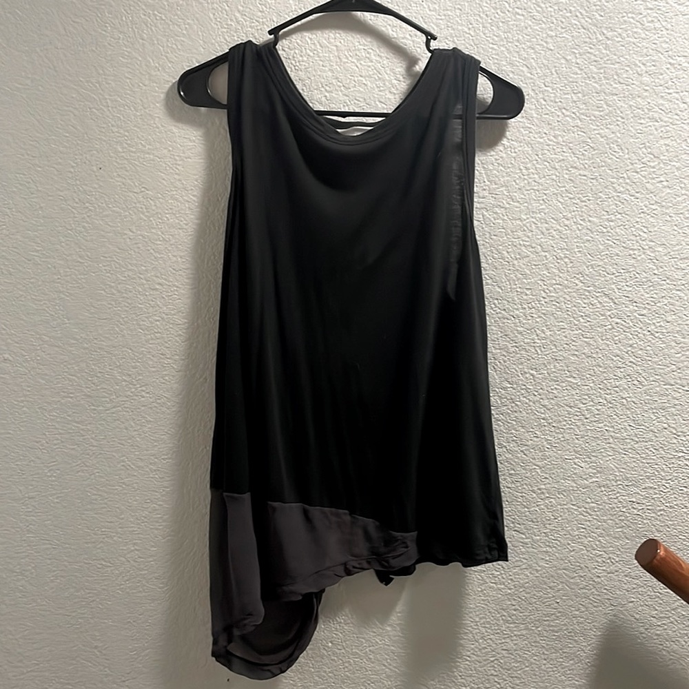 Asymmetrical black razor back tank top w’ mesh and exposed zipper on back